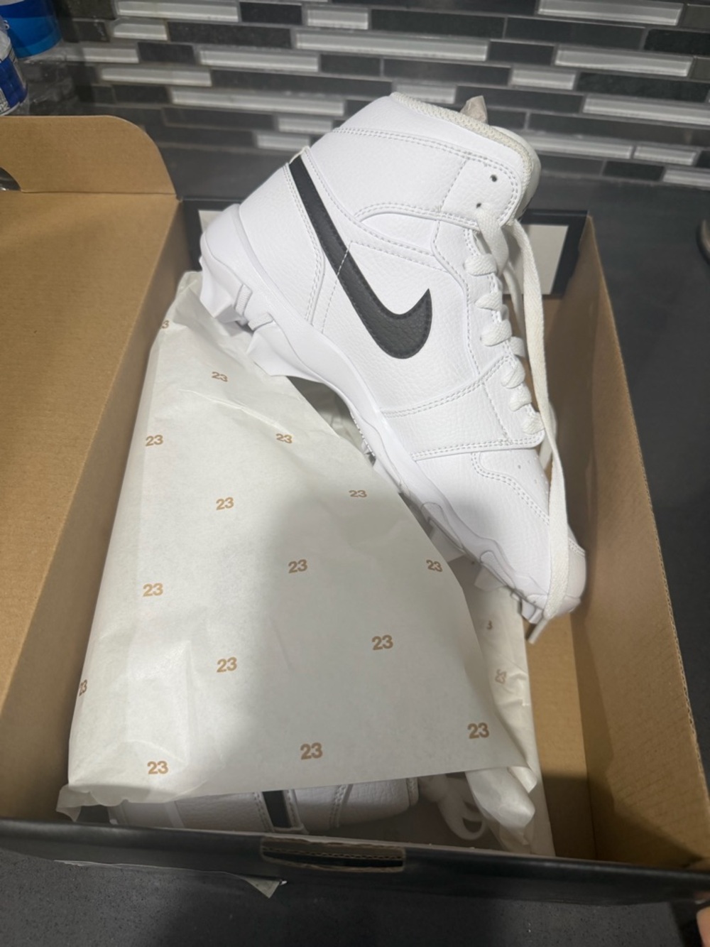 Nike White High-Top Baseball Cleats with Black Swoosh Accent
